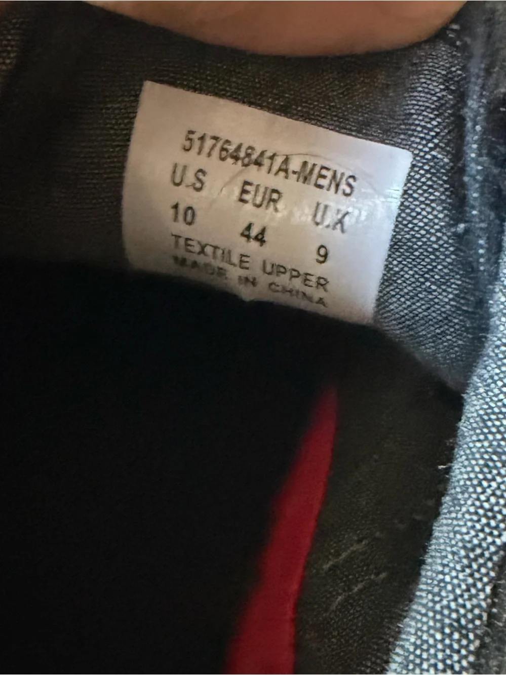 Levi's Black Canvas Low-Top Sneakers with Brown Heel Accent and White Sole